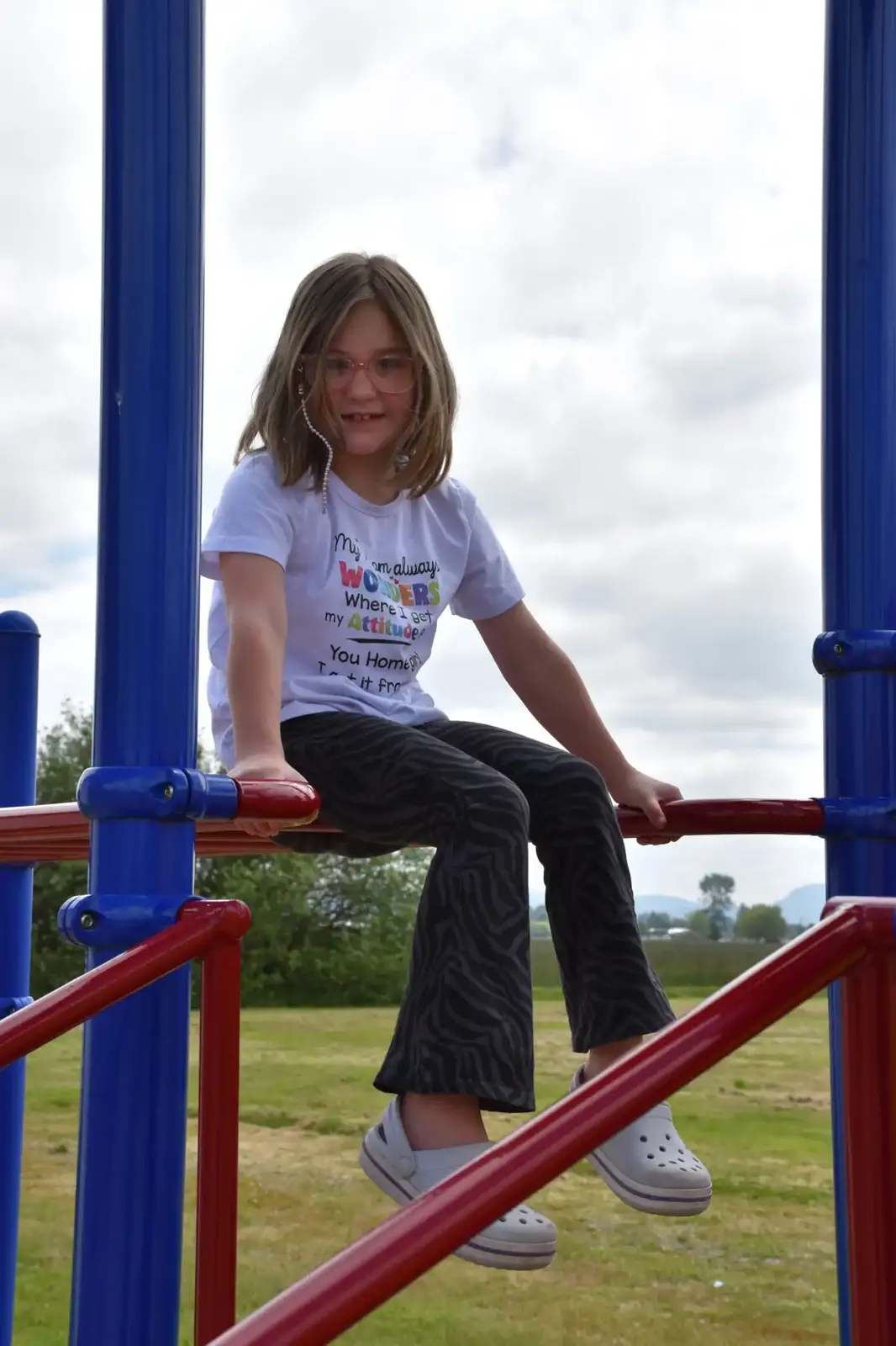 A student on the play structure