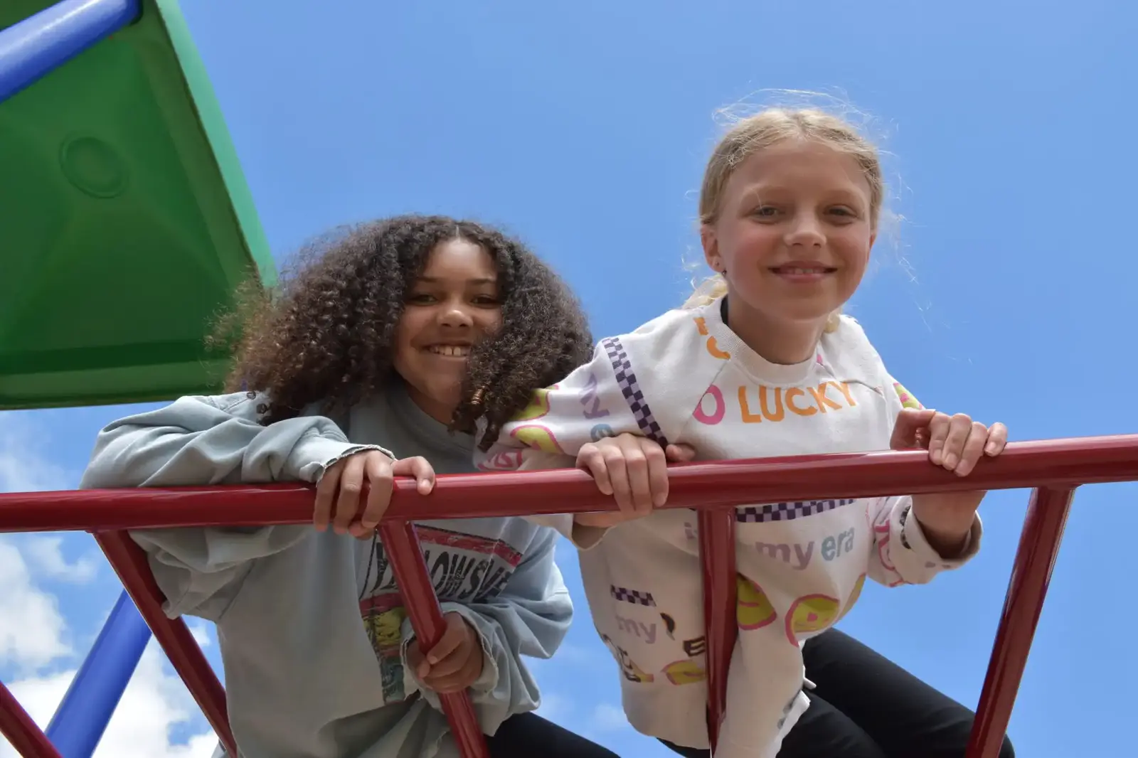 Two friends on the climbing frame