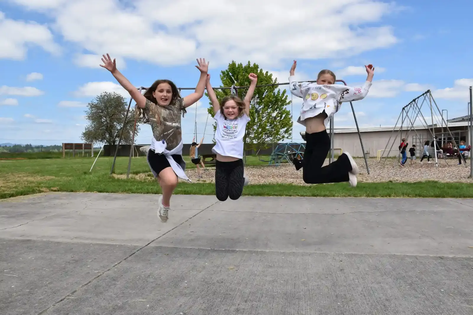 Students jumping for joy on the school playground