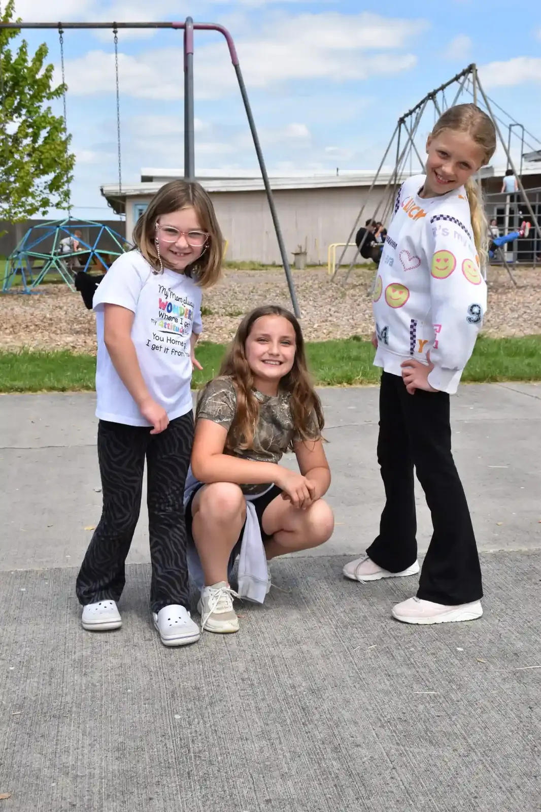 Friends posing on the playground