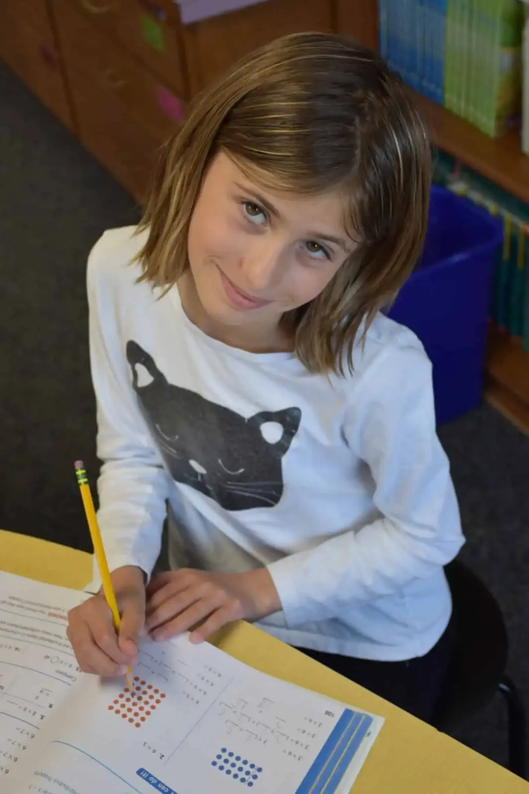 A student writing in her notebook