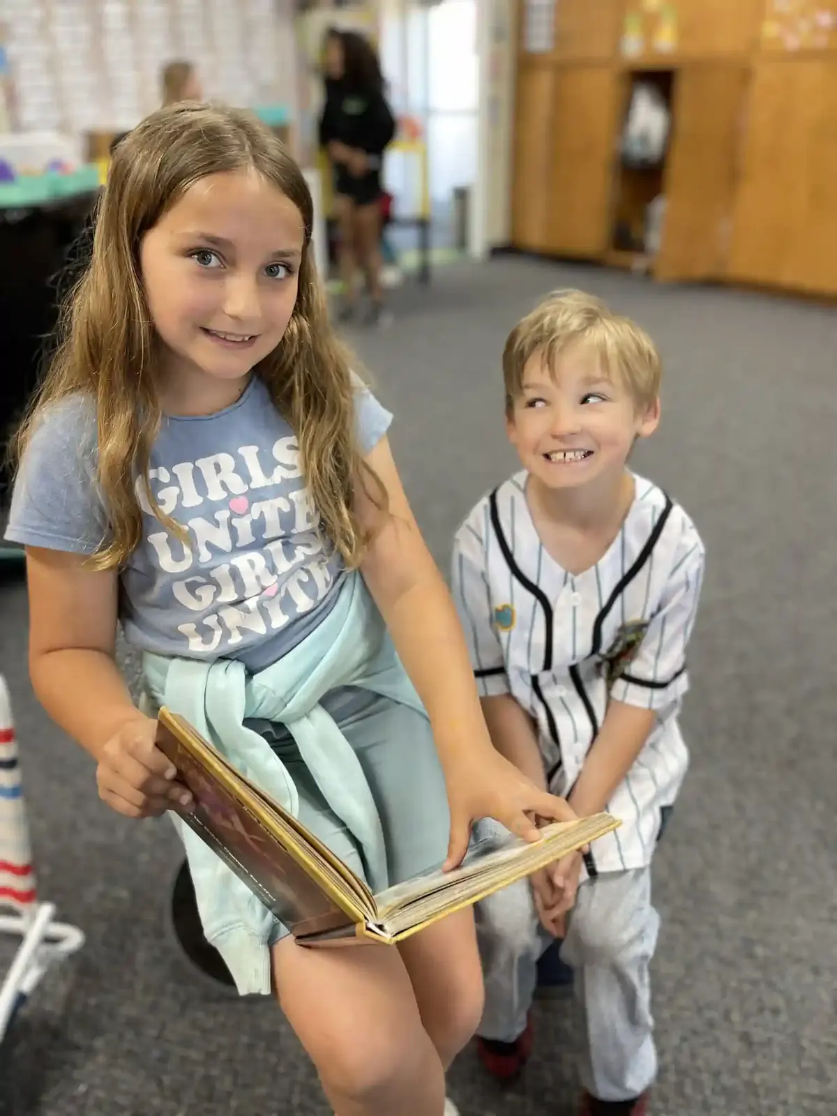 Two students reading side by side