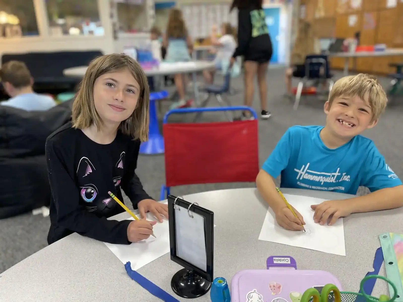 Two students working together at a classroom table